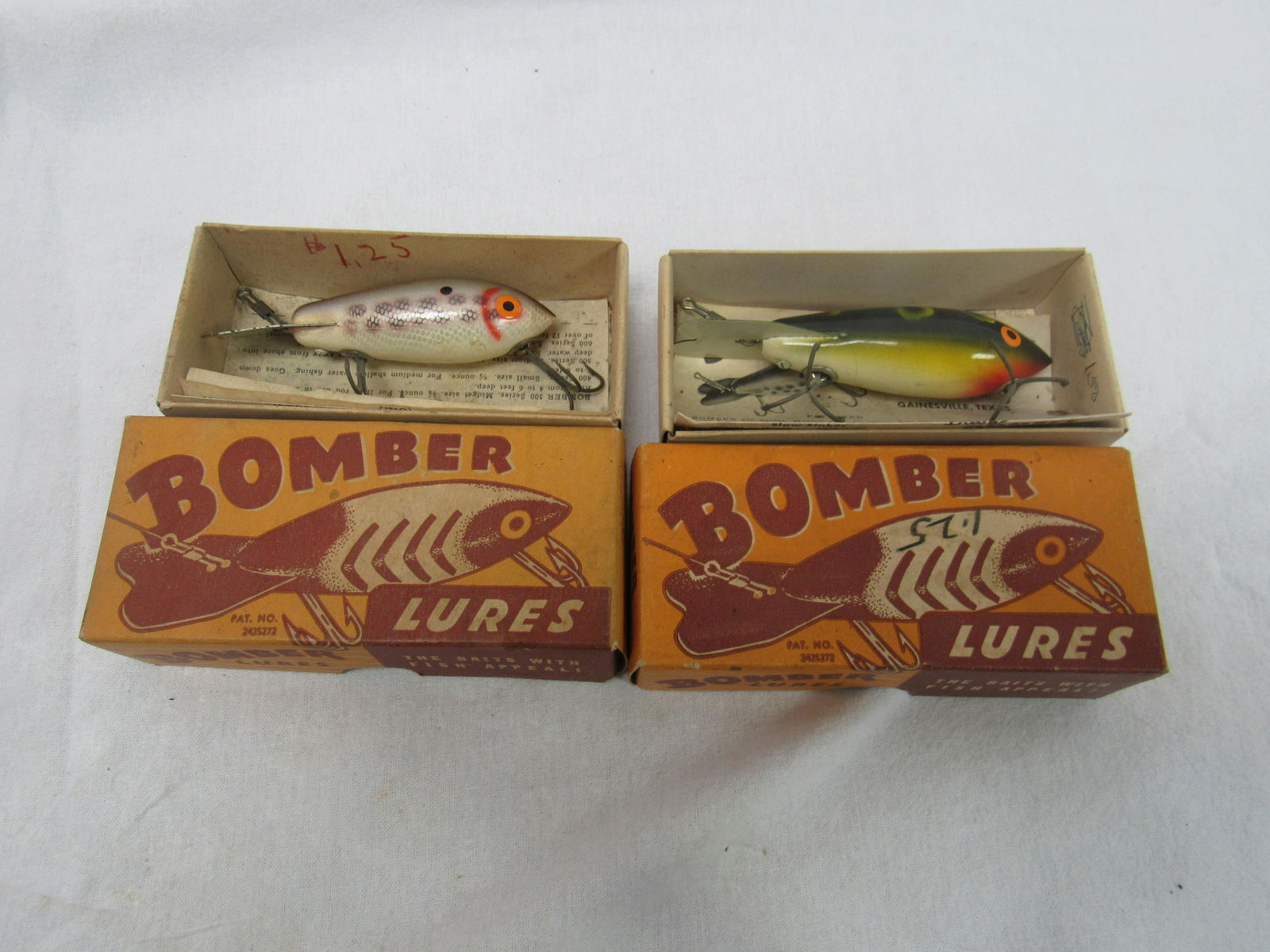 Lot of 2 NOS Bomber Fishing Lures: Lot of 2 NOS Bomber Fishing Lures. Lures are brand new in original boxes with paperwork. Excellent condition.