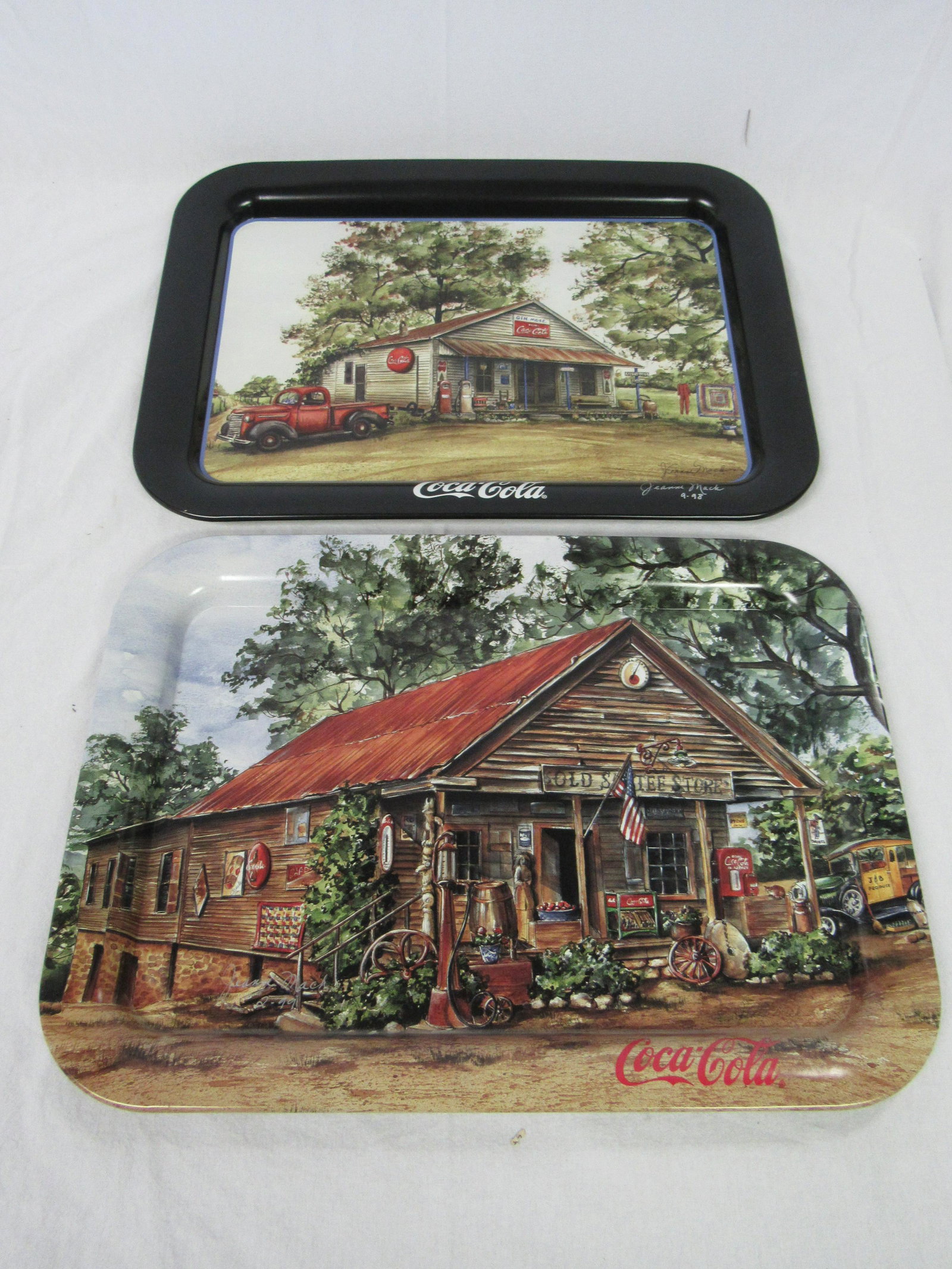 Lot of 2 signed Jeanne Mack 1997 & 1998 Coke Trays: Lot of 2 signed Jeanne Mack 1997 Gen. Mdse. & 1998 The Old Sautee Store Coke Trays. Both in overall excellent condition and measures 17.5 x 12.75"