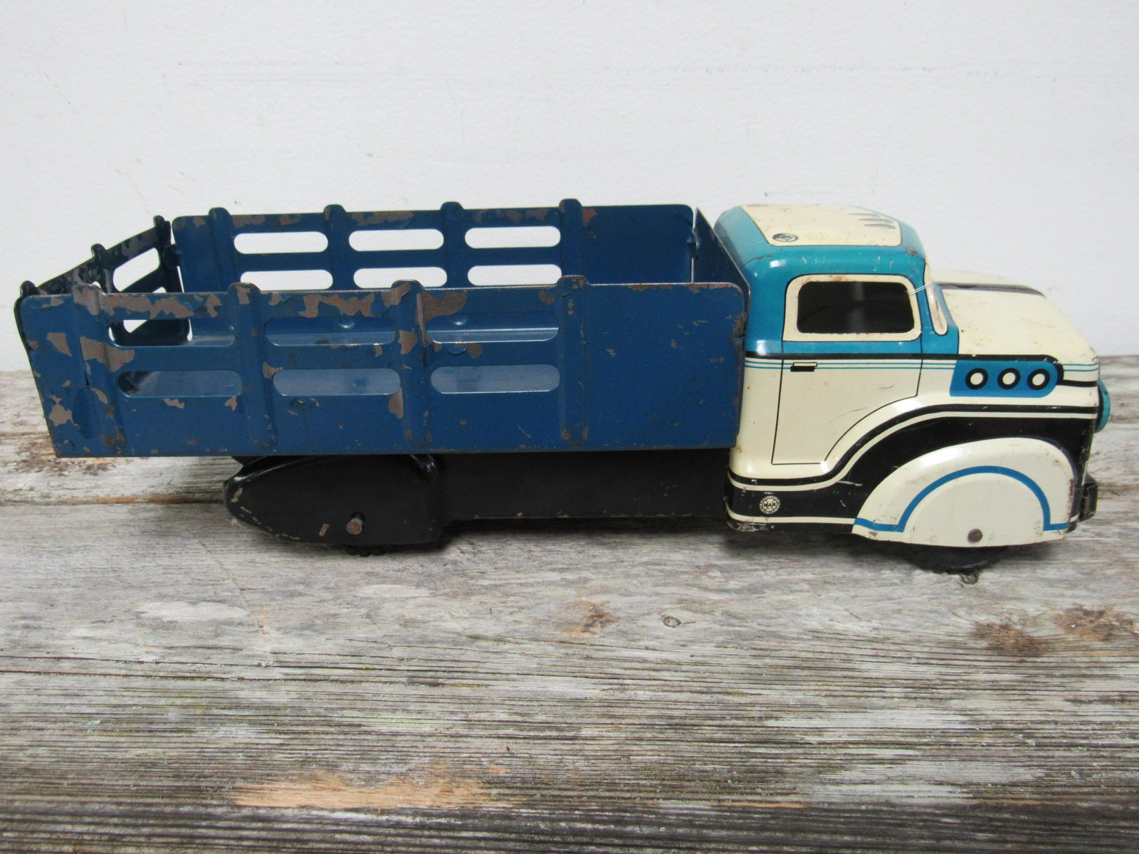 1950's Marx Stake Bed Truck: 1950's Marx Stake Bed Truck with blue, white and black paint scheme. 13.5"x 4.5"