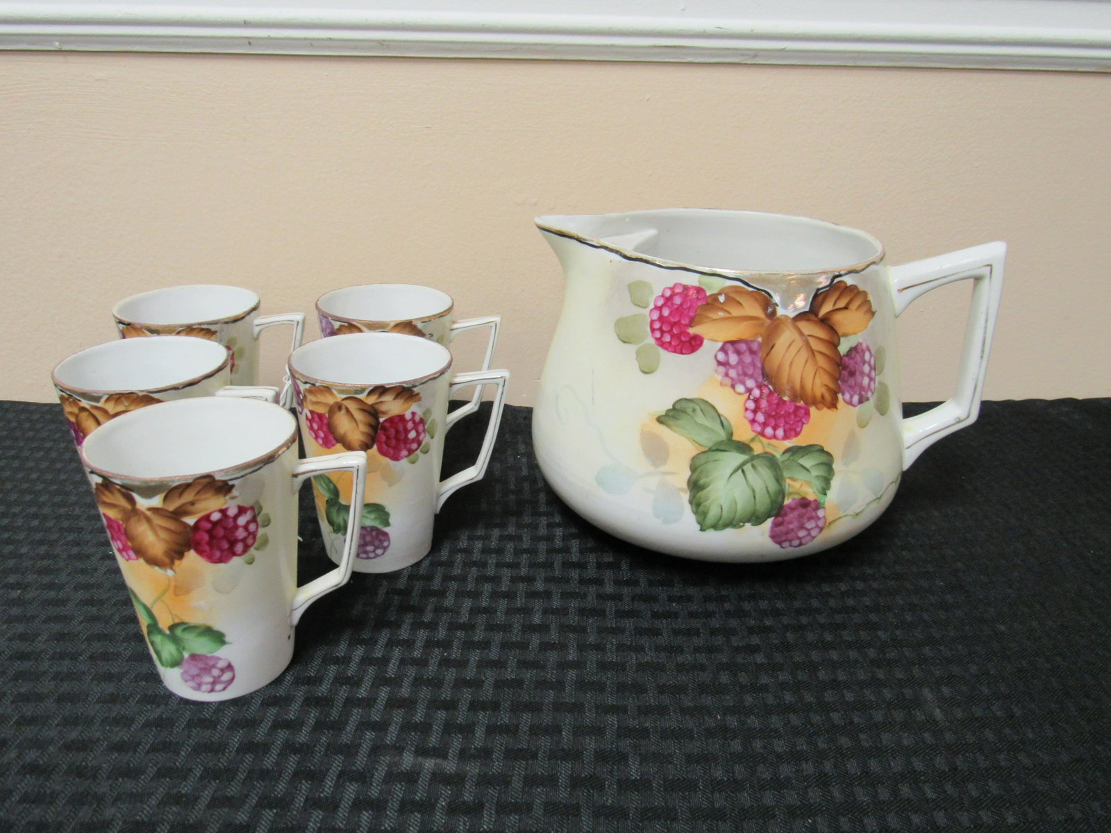 Vintage Nippon Pitcher with 5 Mugs: Vintage Nippon Pitcher with 5 Mugs. Hand painted. Excellent condition. Bottom marked "China-hand painted Nippon", Pitcher 6" long and 7.25" diameter, Mugs 4" long and 2.75" diameter