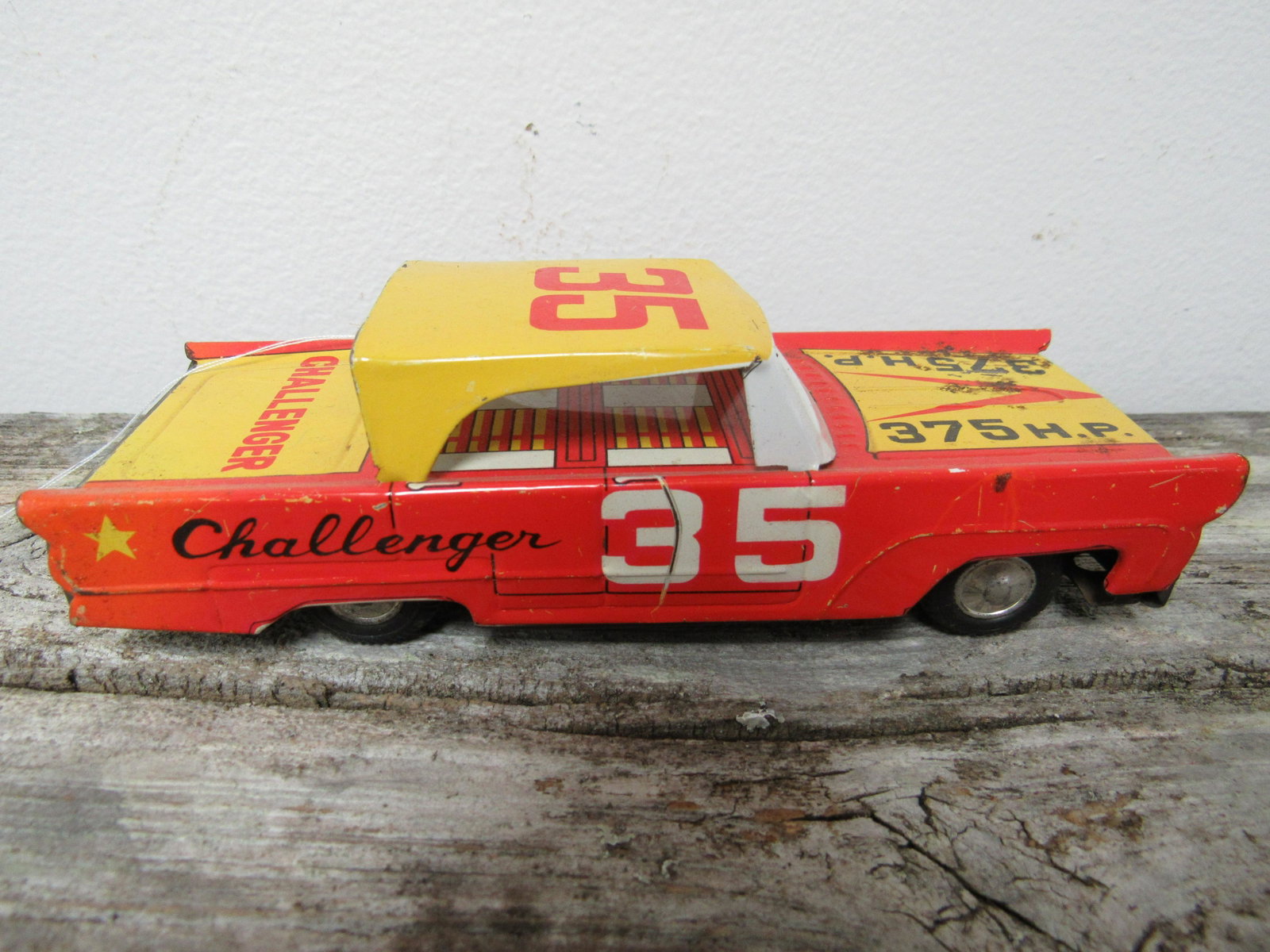 1960's Tin Friction "#35 Challenger": 1960's Tin Friction "#35 Challenger". Working motor. 5.75" x 2.25"
