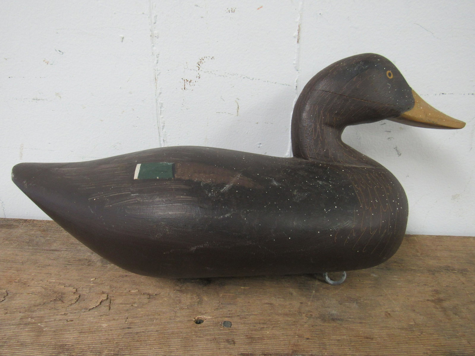 Paul Gibson (1902-1984) Hand Carved Mallard Hen Decoy: Paul Gibson (1902-1984) Hand Carved Mallard Hen Decoy. Excellent condition. Crack and white paint flex on right side of face, as photographed. 15.5" x 6.75" x 7"