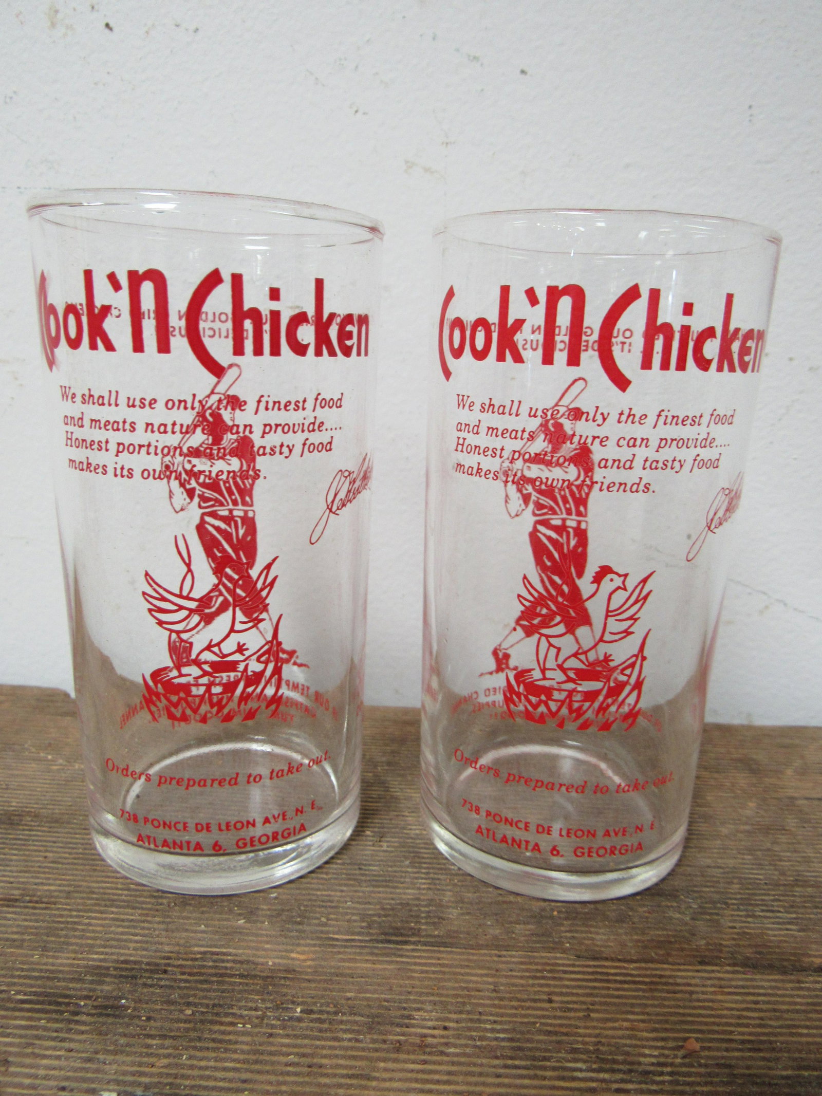 Lot of 2 Vintage "Cook N' Chicken" Tumblers: Lot of 2 Vintage "Cook N' Chicken" Tumblers. Depict baseball player on back and chicken standing in frying pan on the front. "Cook N' Chicken" was located at 738 Ponce de Leon Ave NE, Atlanta, GA. 4.5
