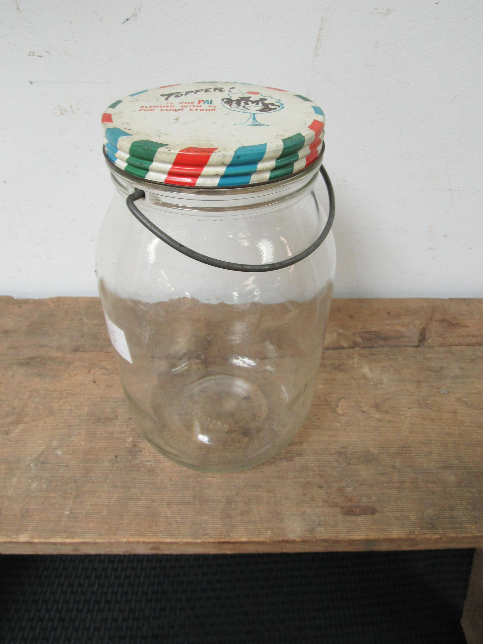 Vintage Topper Advertising Glass Jar with Original Wire: Vintage Topper Advertising Glass Jar with Original Wire Bail Handle. Very good condition. 10.5"
