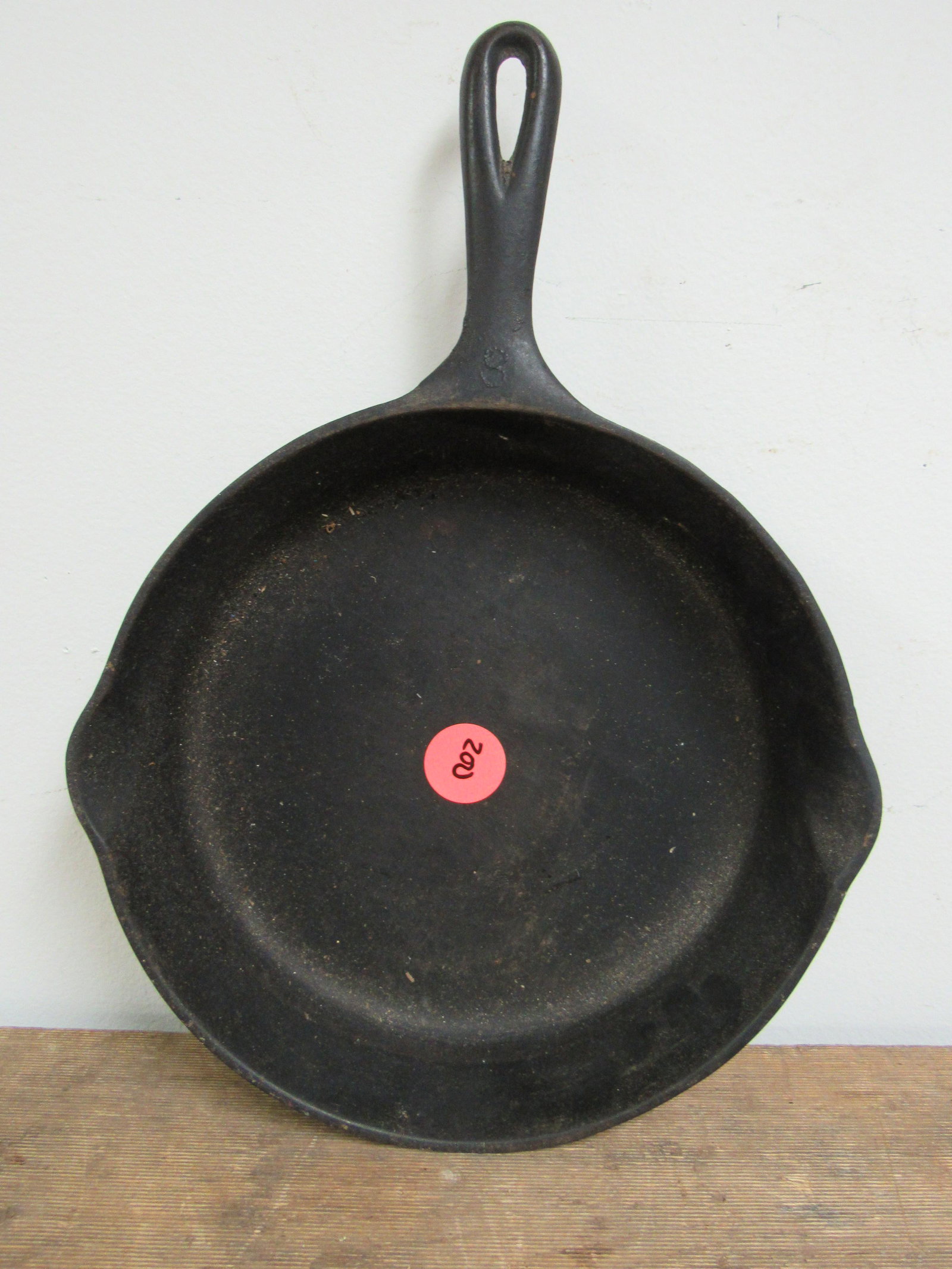 Antique Griswold Good Health No. 9 Cast Iron Skillet: Antique Griswold Good Health No. 9 Cast Iron Skillet. Good condition. Small crack on side, as photographed. 11.25