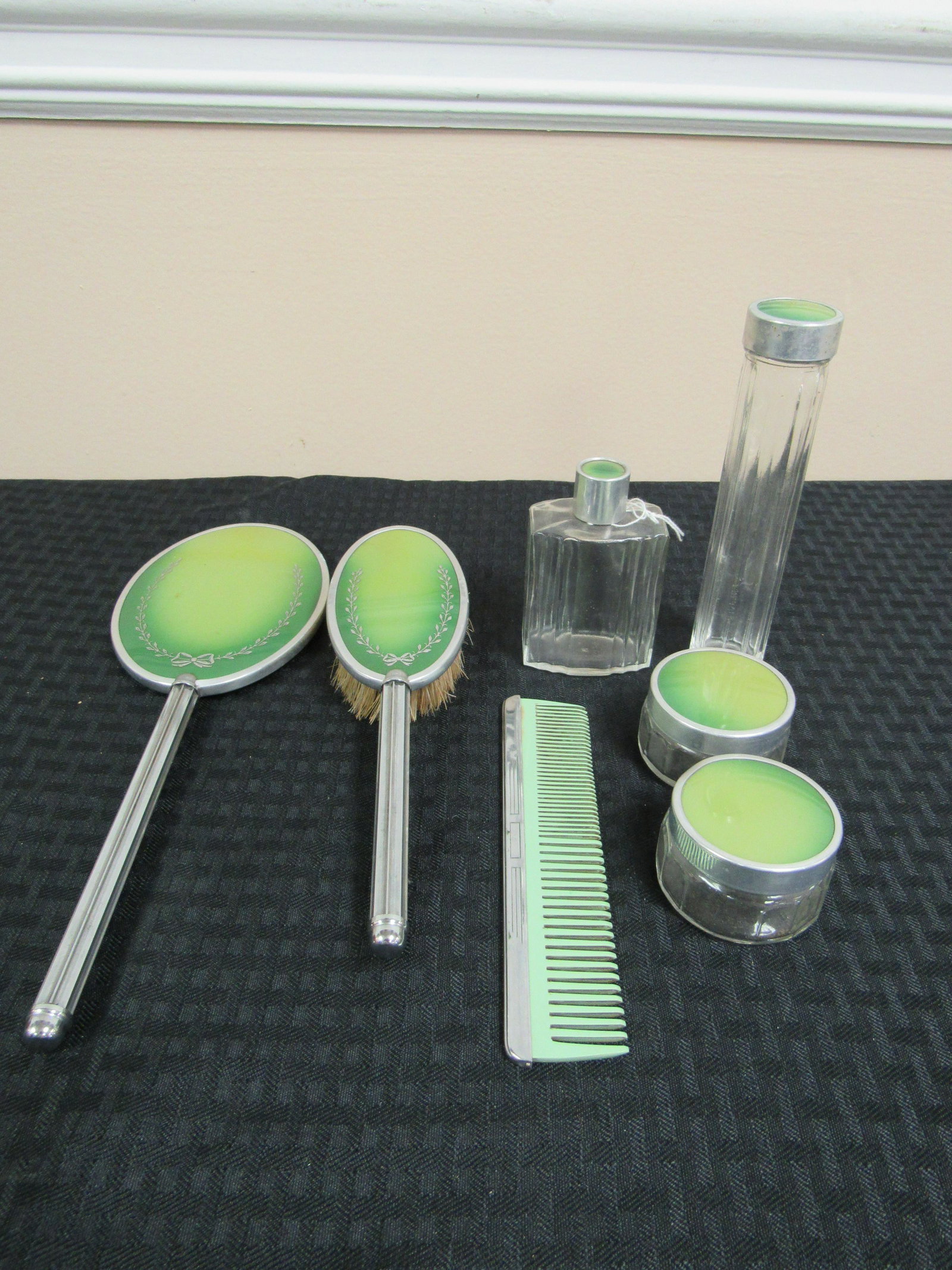 Vintage 7 Piece Celluloid Dresser Set: Vintage 7 Piece Celluloid Dresser Set. Includes Mirror, Brush, Comb, 2 Powder Jars, Perfume Bottle and Talcum Jar. Excellent condition.