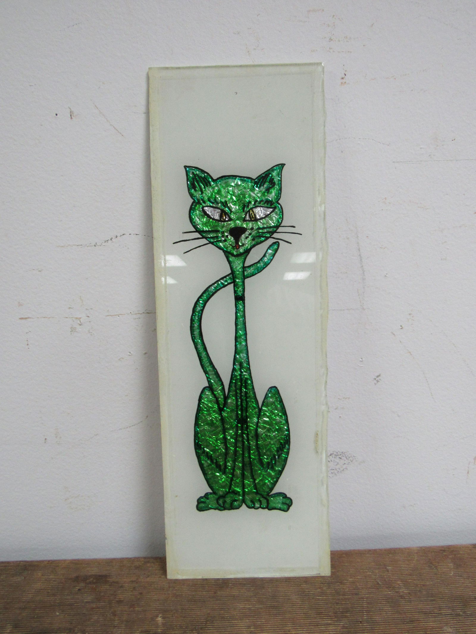 Vintage Foil Art Cat: Vintage Foil Art Cat. Constructed of foil, glass and paint. Depicts green long neck cat. Good condition. 14" x 4.5"