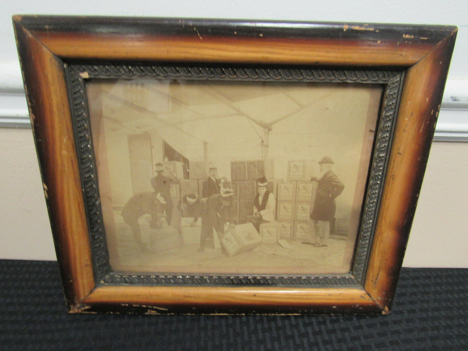 Circa 1890 - 1900 Albumen Photograph Housed in Period: Circa 1890 - 1900 Albumen Photograph Housed in Period Frame depicting Asian workers unloading crates of tea marked with Star of David. Label on tea reads "W.J. Gouled & Co. Japan Tea". Good condition