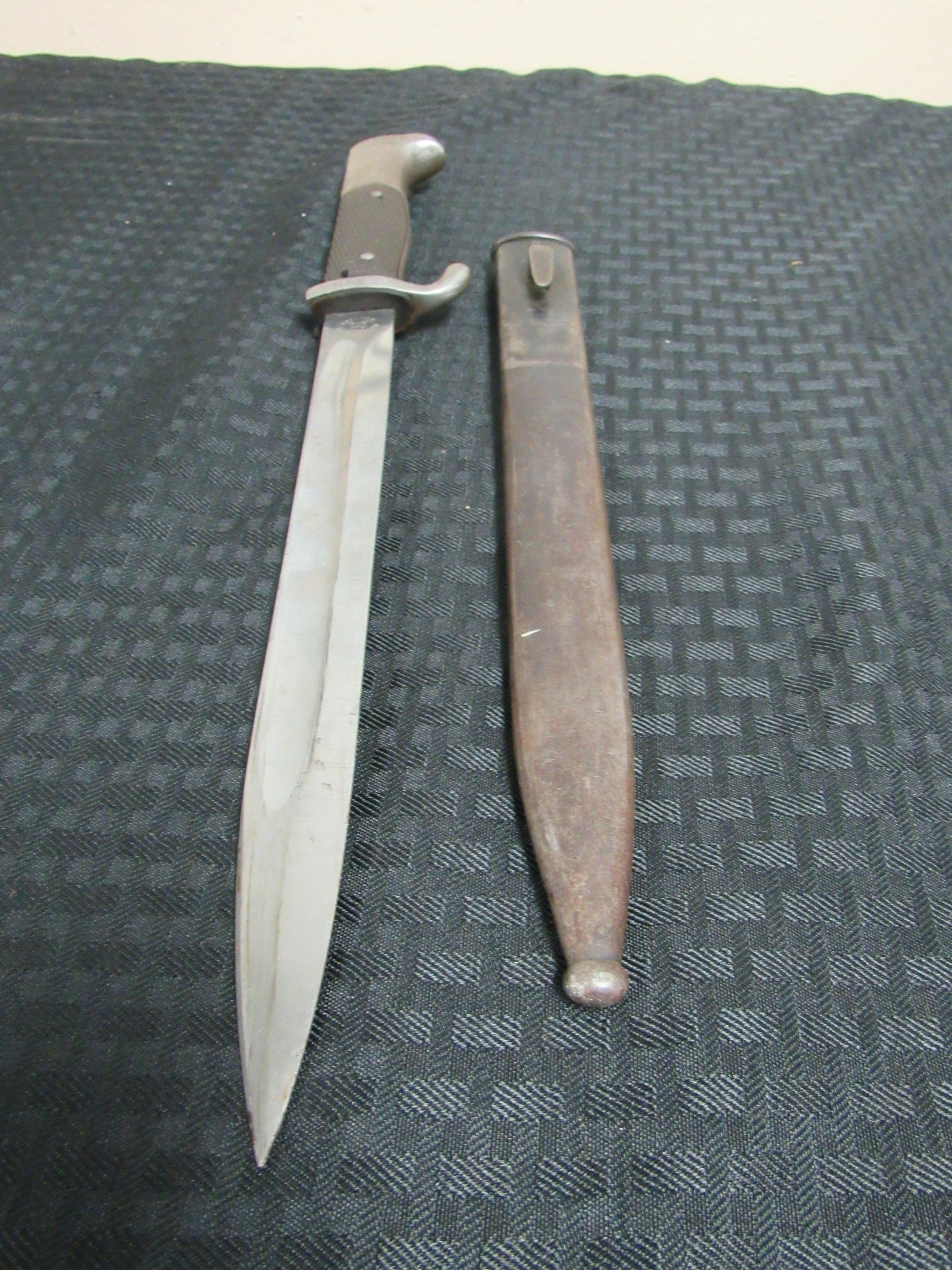 WWII German Alexander Coppel Mauser Dress Bayonet: WWII German Alexander Coppel Mauser Dress Bayonet. Blade signed Soligen. Hilt stamped RFV. Very good condition and in original sheath. Overall 15.25", Blade 10"