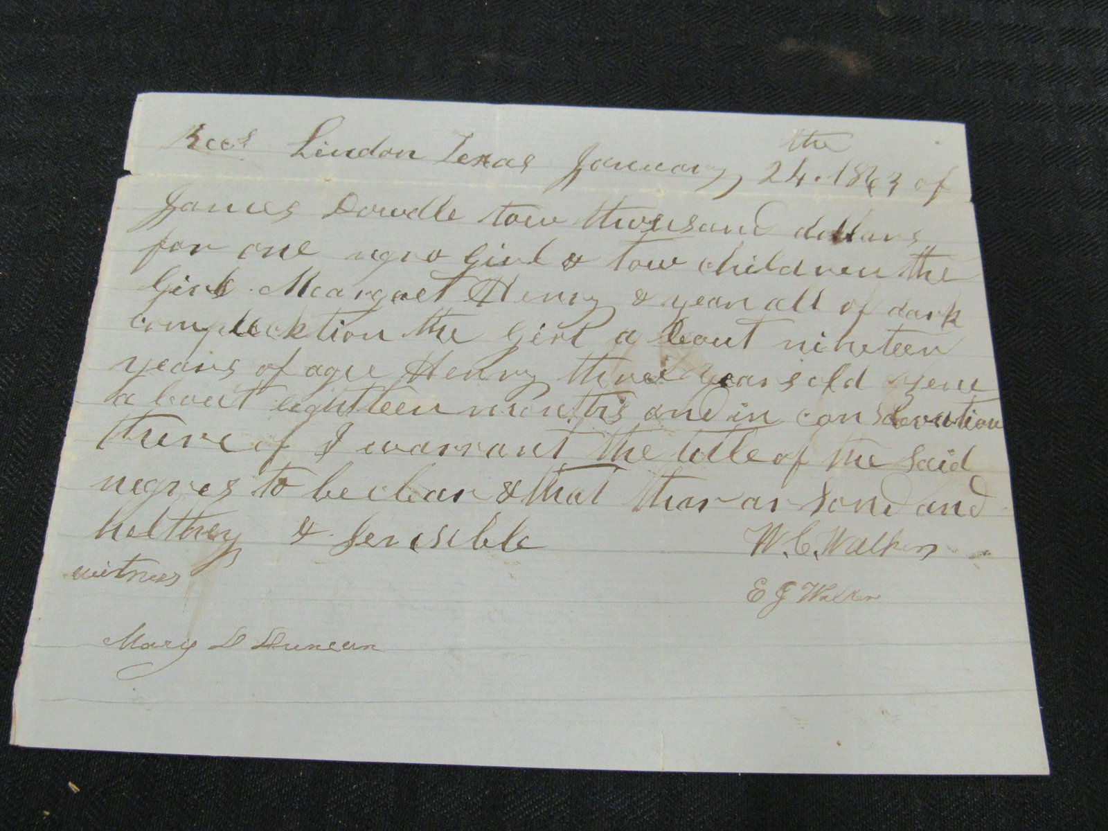 Circa 1863 Rare Confederate Lindon, Texas Slave: Circa 1863 Rare Confederate Lindon, Texas Slave Document. Document mentions sale of girl and 2 children for $2000 on blue lined blockade paper with watermark. Very good condition. 8" x 6"