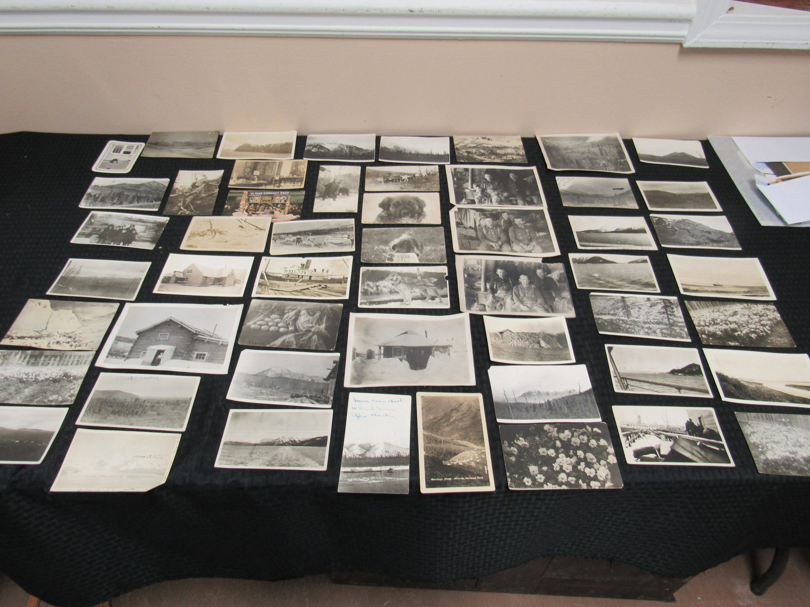 Circa 1915-1920 Lot of 35+ Alaskan Real Photo Postcards: Circa 1915-1920 Lot of 35+ Alaskan Real Photo Postcards and Snapshots. Subject matter includes: sled dogs, snow scenes, cabin interior, reindeer, civilian views. Fair to good condition.