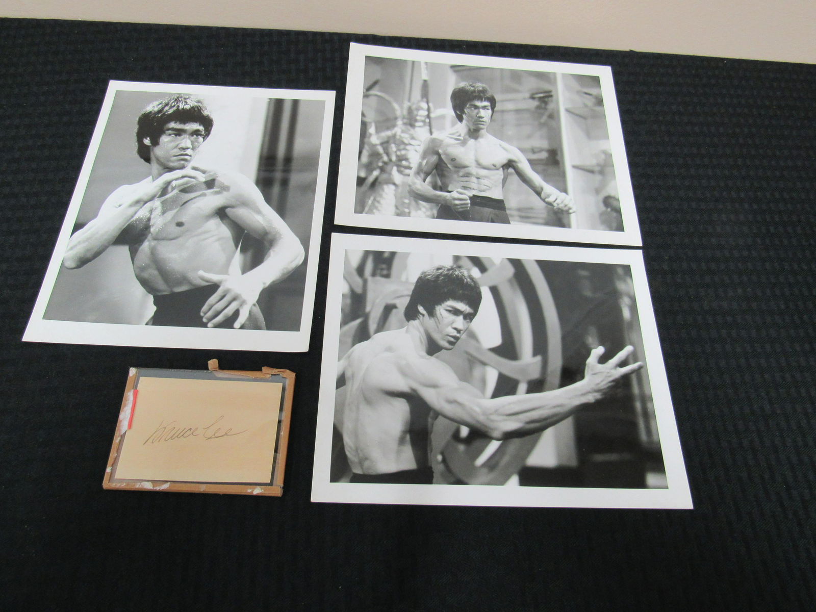 Bruce Lee Clipped Signature with 3 - 8" x 10" "Enter: Bruce Lee Clipped Signature with 3 - 8" x 10" "Enter the Dragon" Pressed Photographs.