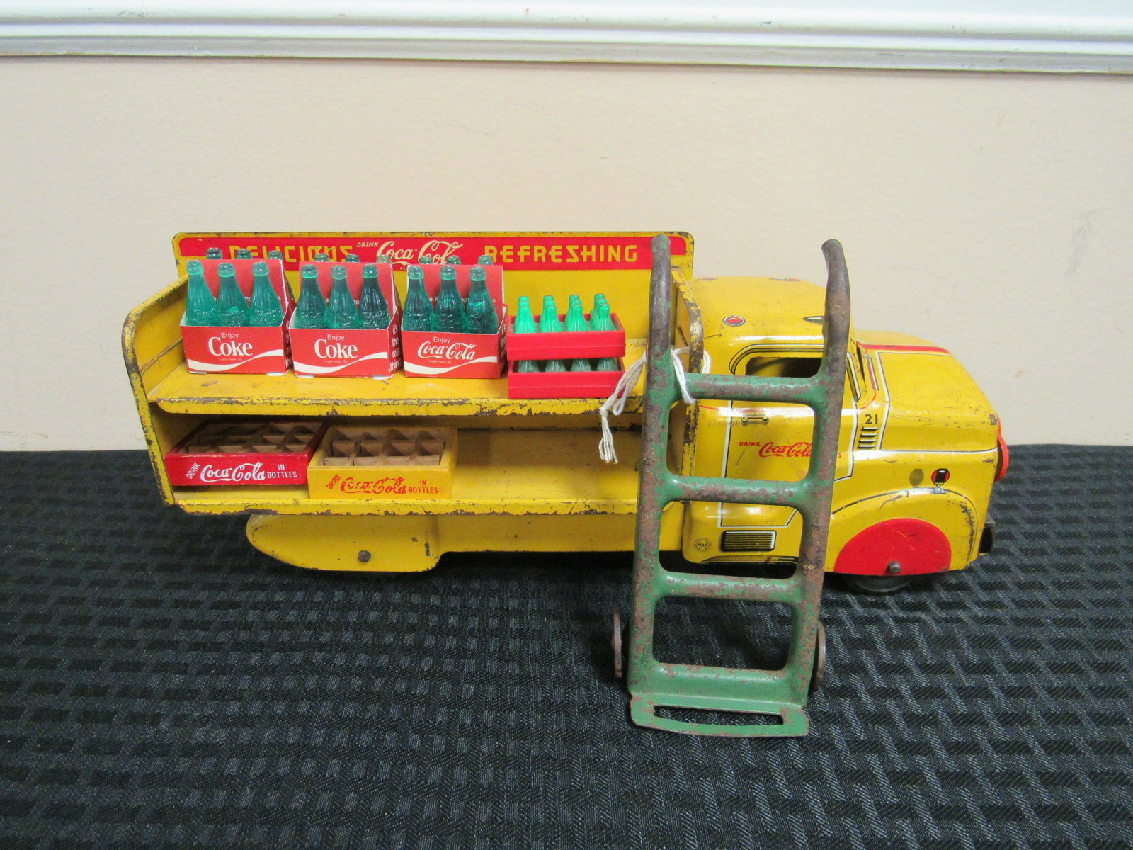 Circa 1954 Marx Pressed Steel Coca Cola Delivery Truck: Circa 1954 Marx Pressed Steel Coca Cola Delivery Truck with Coke Crates and Pressed Steel Dolly. Very good condition. 12.5" x 5"