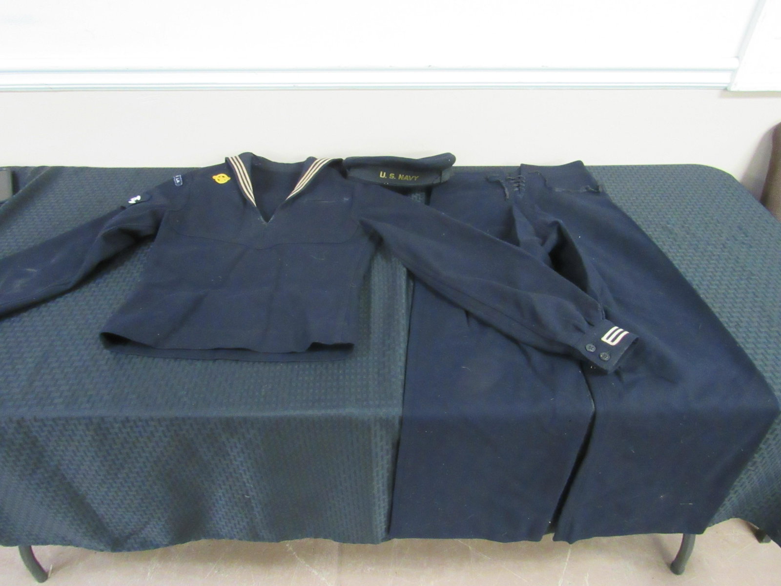Circa 1943 WWII U.S.S. Shangri-la 328 "Cracker Jack": Circa 1943 WWII U.S.S. Shangri-la 328 "Cracker Jack" Naval Uniform. Includes pants, jacket and hat. All in good condition.