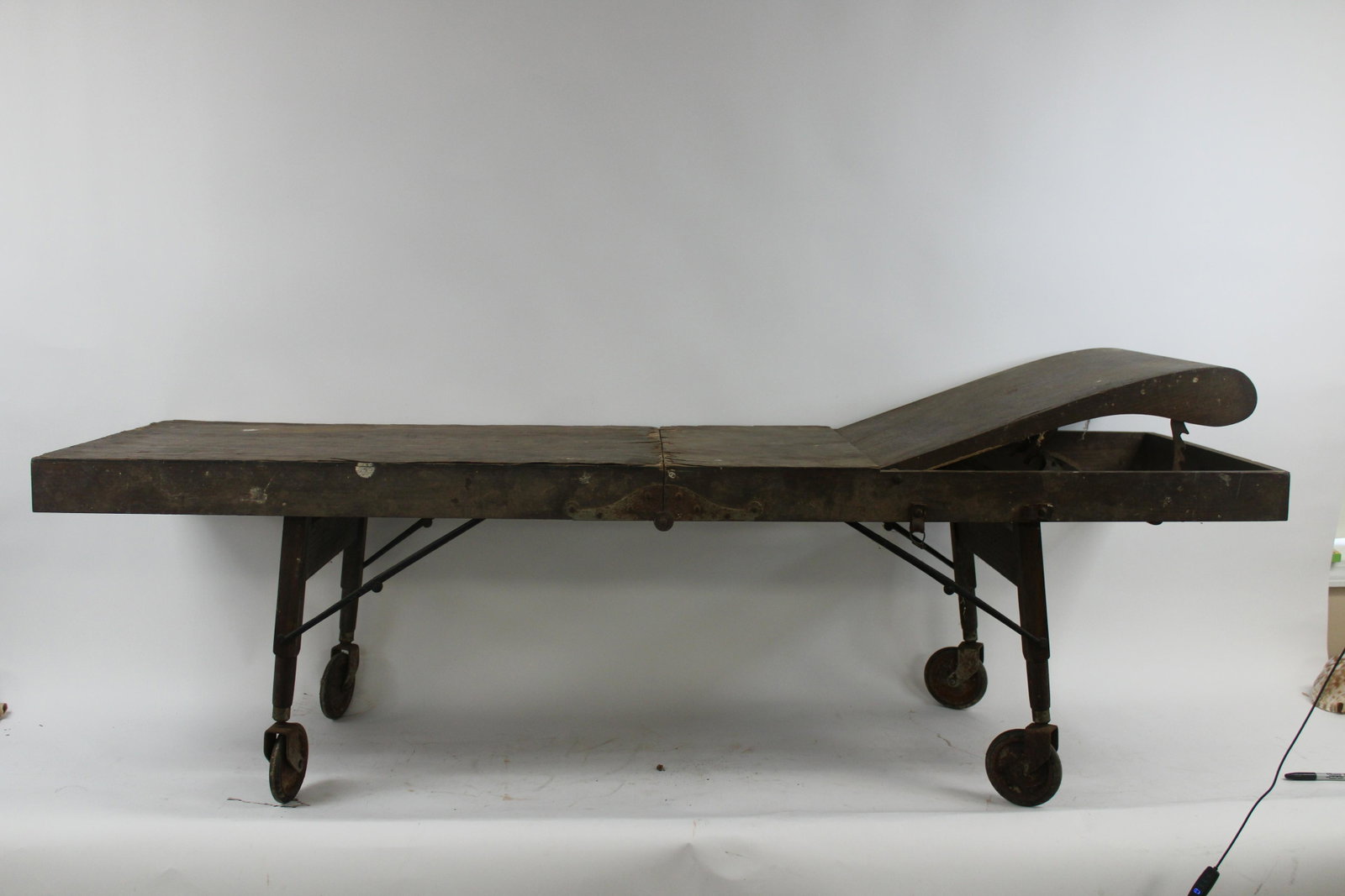 Circa 1920: Circa 1920's Undertaker Supply Co. Cooling Table. Overall good condition with some damage. Measures 74.5" x 22.5" opened, 38" x 6" closed.