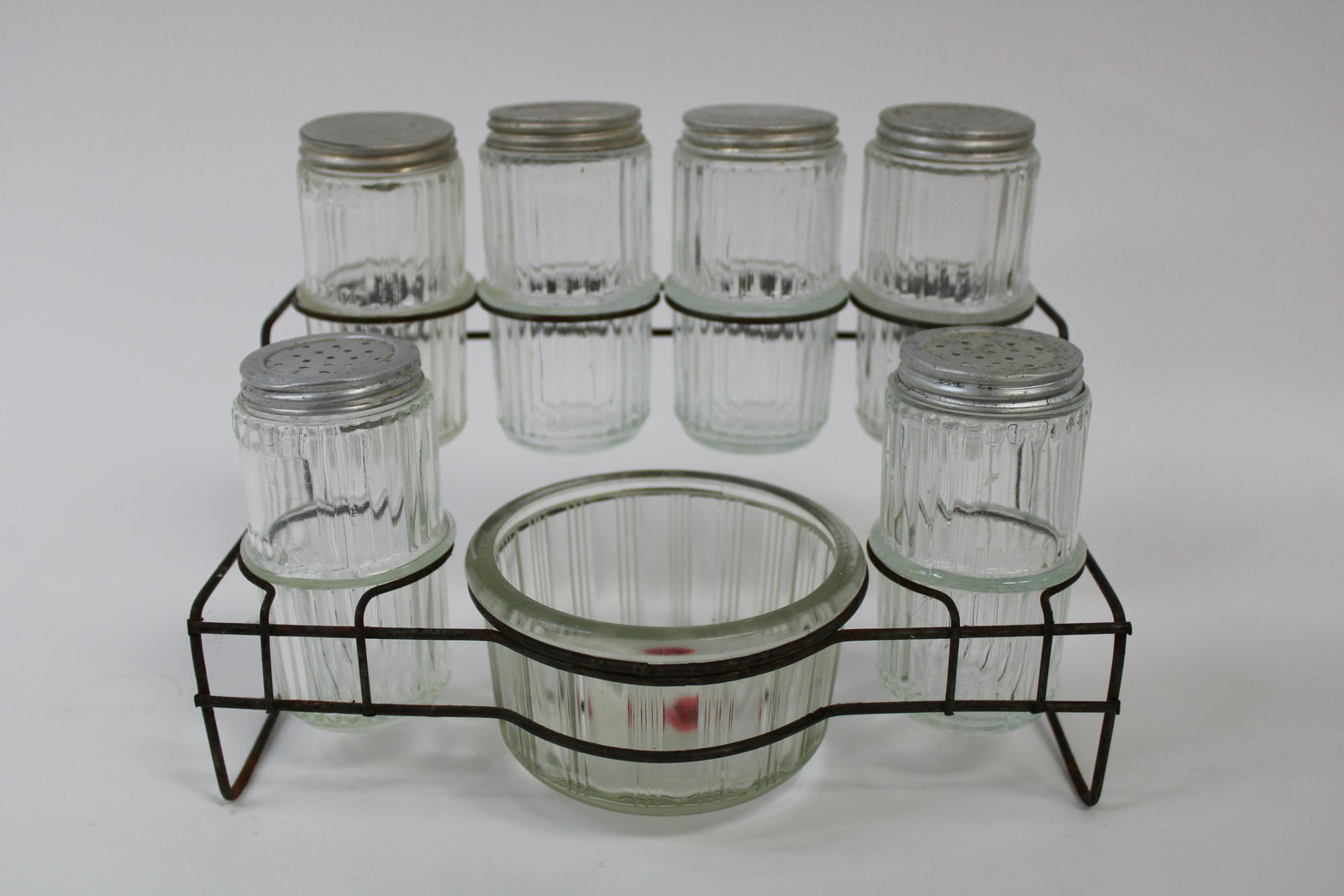 Vintage Hoosier Spice Rack.: Vintage Hoosier Spice Rack. Overall excellent condition. Contains 8pcs. Measures 7.5" x 10" x 6".