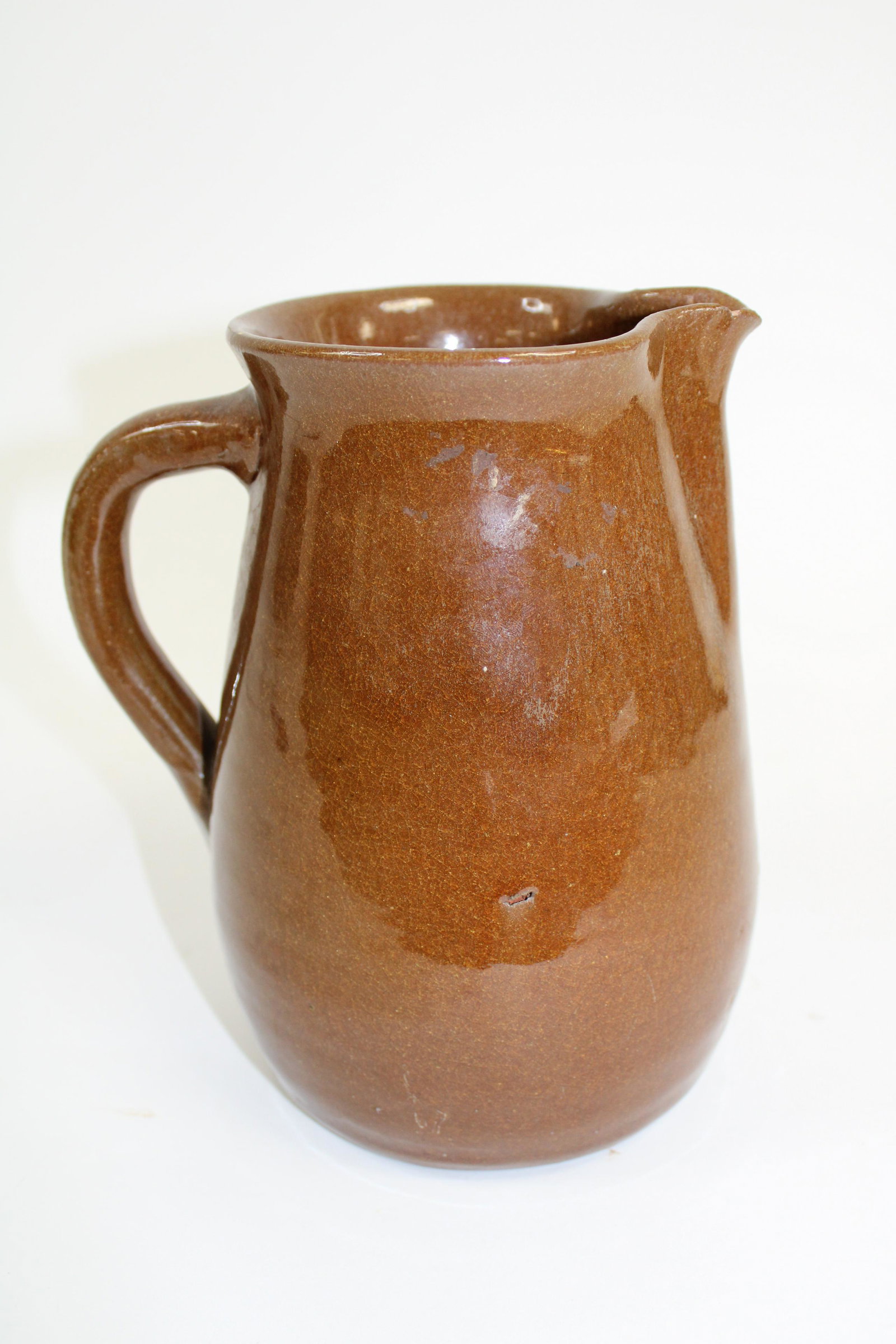 White Co. Ga. Cleater James "C.J" Meaders (1921-2003): White Co. Ga. Cleater James "C.J" Meaders (1921-2003) Buttermilk Pitcher. Overall good condition with 2 chips on spout, as photographed. Measures 8" tall.