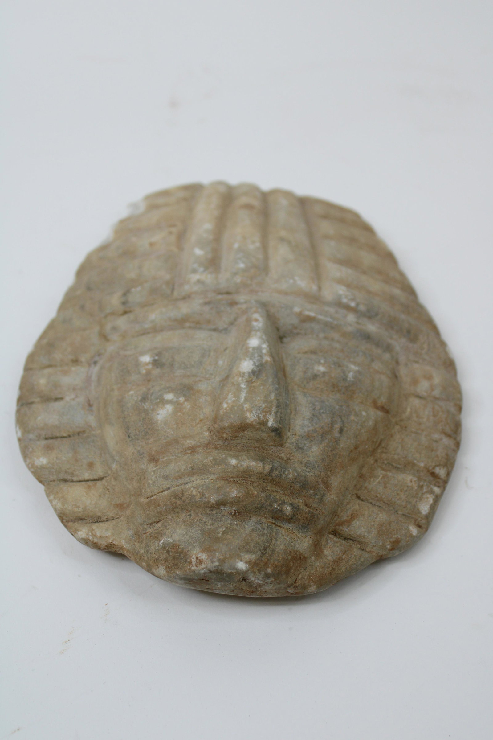 Mayan Indian Soap Stone Death Mask.: Mayan Indian Soap Stone Death Mask. Overall very good condition with chip on left side, as photographed. From the Thomas Davis Collection. Measures 10" x 7.25".