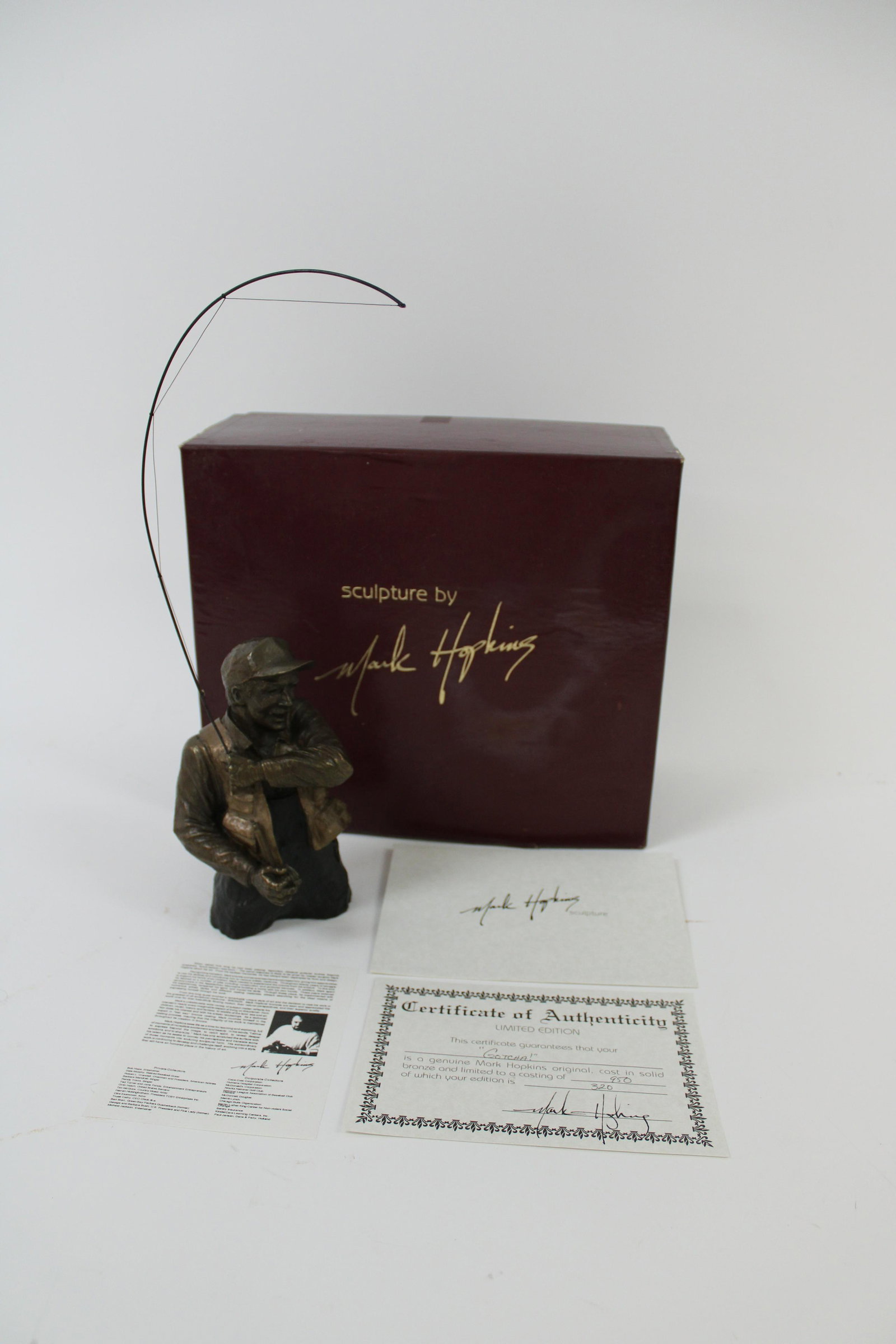 Mark Hopkins Bronze Sculpture "gotcha" Of Man Fishing: Mark Hopkins Bronze Sculpture "Gotcha" of Man Fishing in Original Box 320/950. Overall excellent condition. Man measures 7" tall rod measures 15" tall