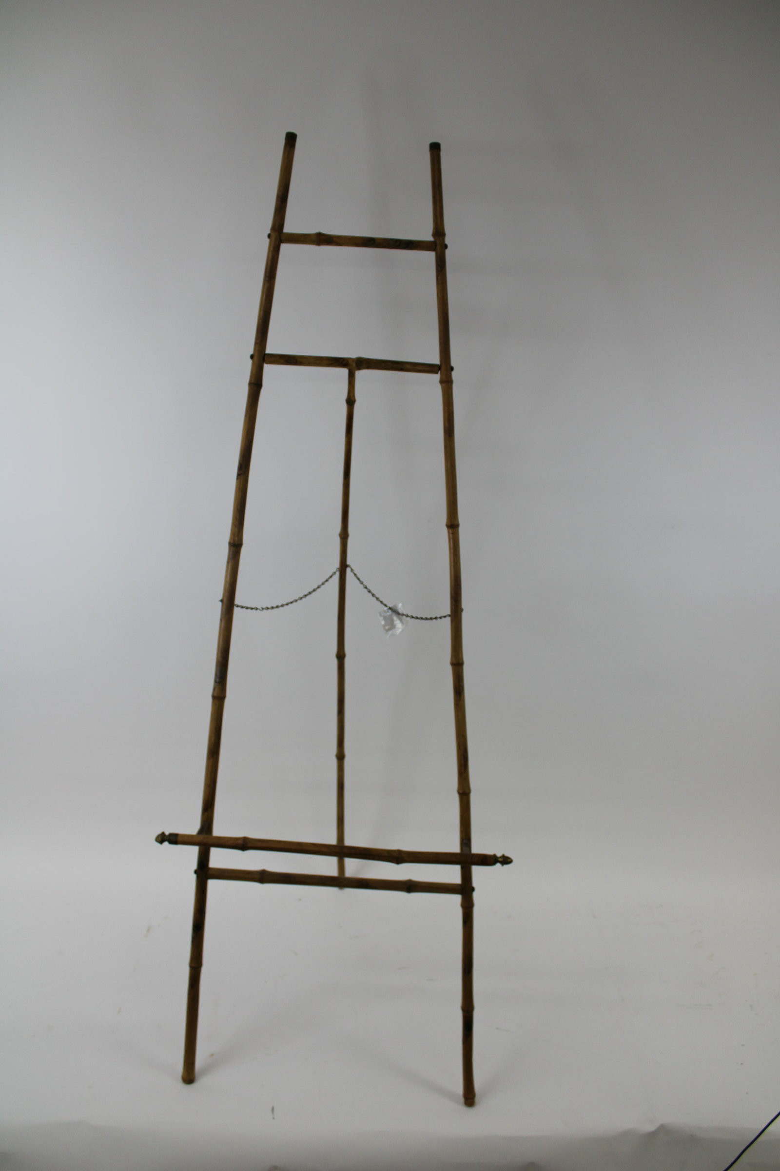 Victorian Bamboo Easel With Brass Escutcheons.: Victorian Bamboo Easel With Brass Escutcheons. Overall very good condition. Measures 60" x 21".
