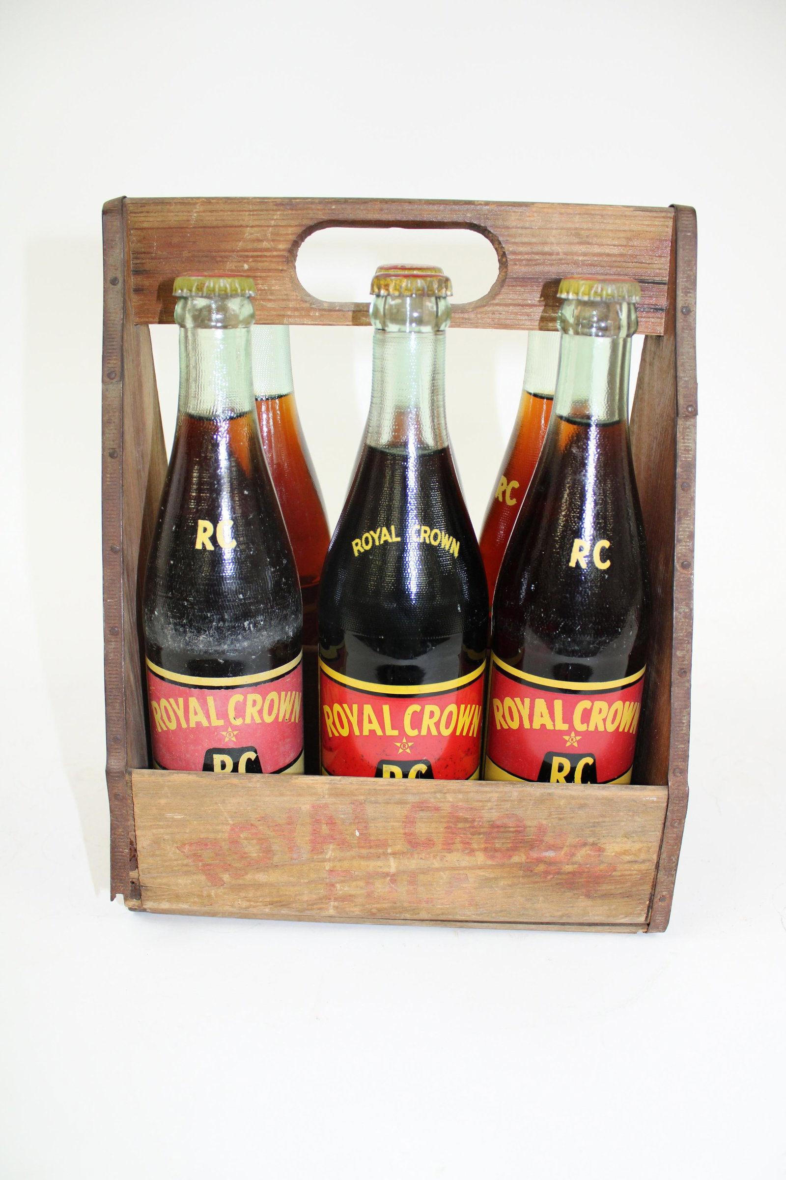 Early RC Cola 6 Pack Carry Case with Original Bottles.: Early RC Cola 6 Pack Carry Case with Original Bottles. Overall good condition. Paint is faded. Measures 10.5" x 8.5".