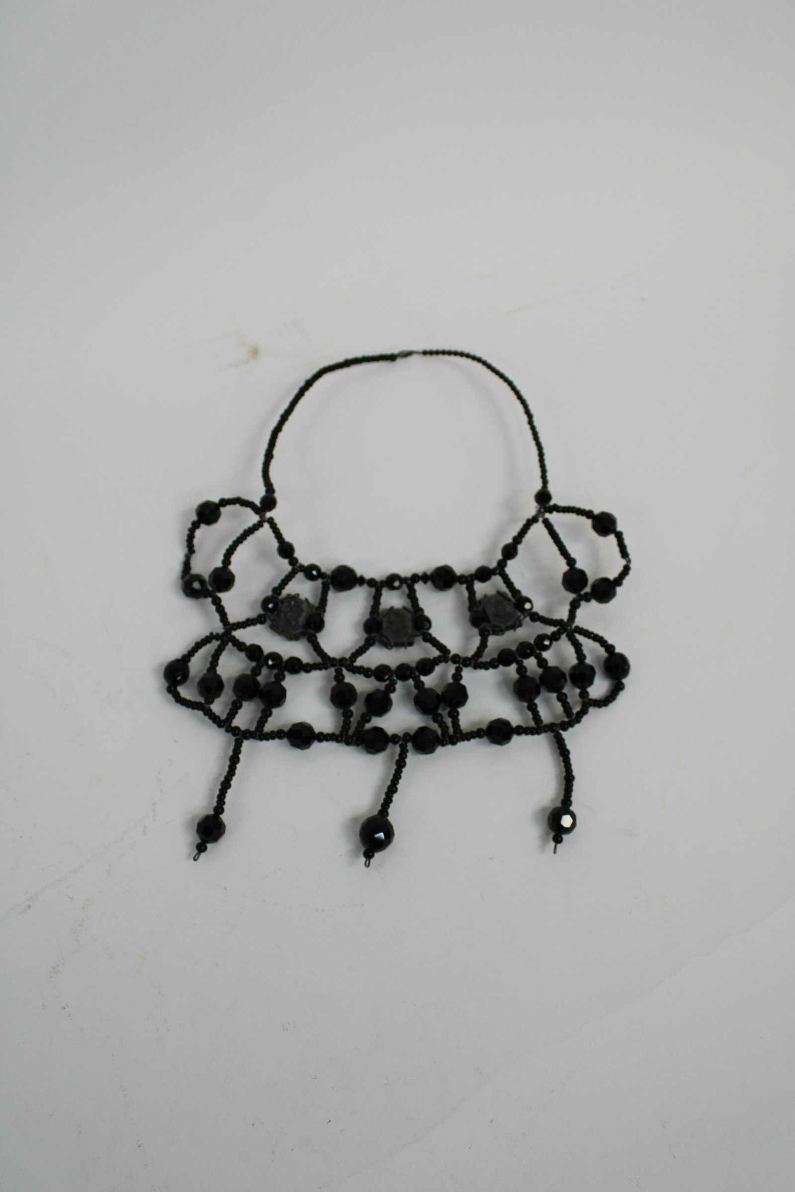 Victorian Athena Minerva Hematite Cameo and French Jet: Victorian Athena Minerva Hematite Cameo and French Jet Necklace. Necklace contains 3 hematite cameos of Athena and Minerva fixated at the top center of the necklace. Necklace constructed of French jet