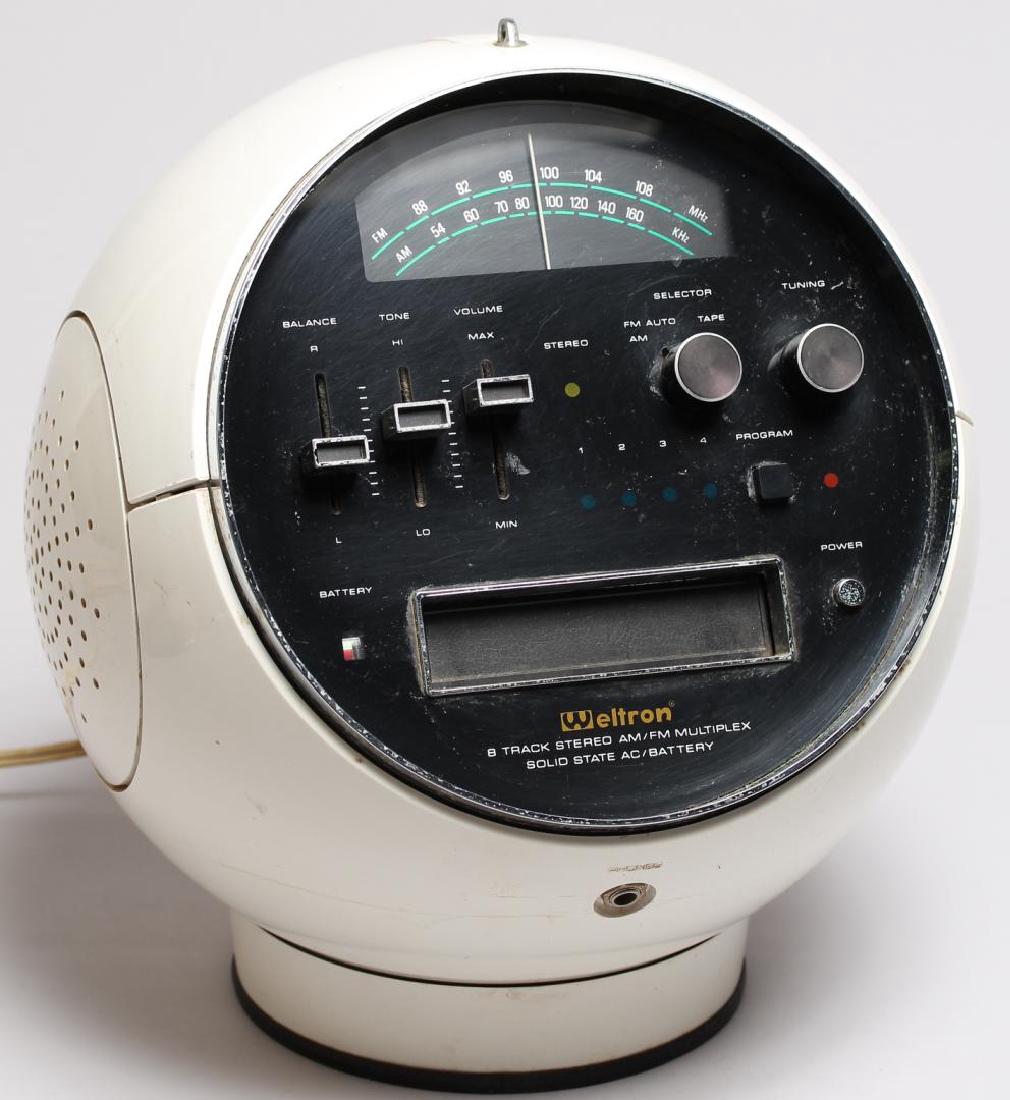 Weltron 2001 “Space Ball” 8 Track Player & Radio: Japan, 1970s, stereo, the ball rotating on the base, with AM/FM radio. 12.5" H X 10" diameter. Lacking antenna and original hanging chain, minor surface wear consistent with age and use.