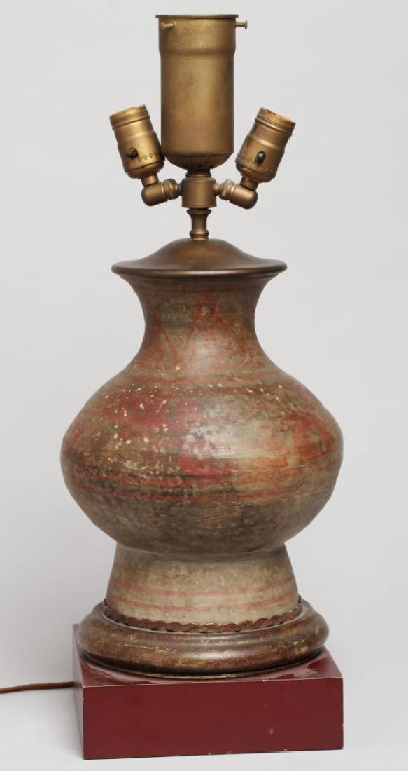 Chinese Han Dynasty Hu Vessel Lamp: The painted pottery with red and black striping, now mounted on a brass and wood base. Vessel: 11" H; overall: 23" H. Lacking on/off switch.