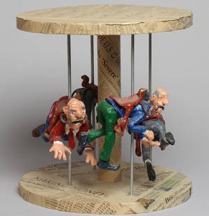 Scott Wilson (American, 20th C.) - Diorama: "Carousel," depicting a roundabout covered in "Investment News" newspapers, the horses substituted with saddled investors. 12.75" H X 12.25" W