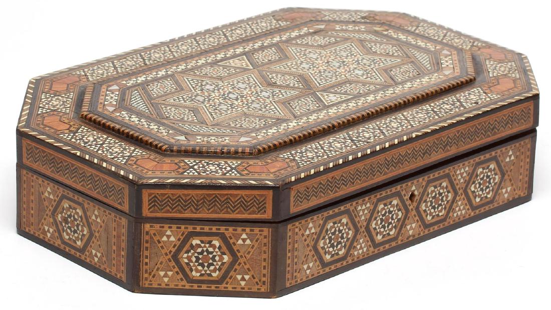 Large North African Inlaid Wood Parquetry Box: Having geometric designs of camel bone, ebony and mother-of-pearl, and a fabric lining; an attached note reads "Ray North Africa 1944.". 2.5" H X 12.25" W X 8" D. Occasional minor losses and some yell