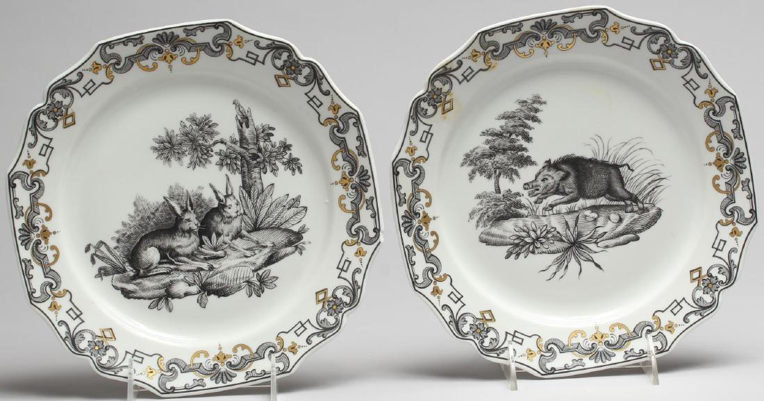 2 Mottahedeh "Du Parquier" Musuem Plates: Porcelain, one depicting a boar, the other rabbits; the backstamps identifying them as reproductions for the Metropolitan Museum of Art. Each: 9.5" diameter.