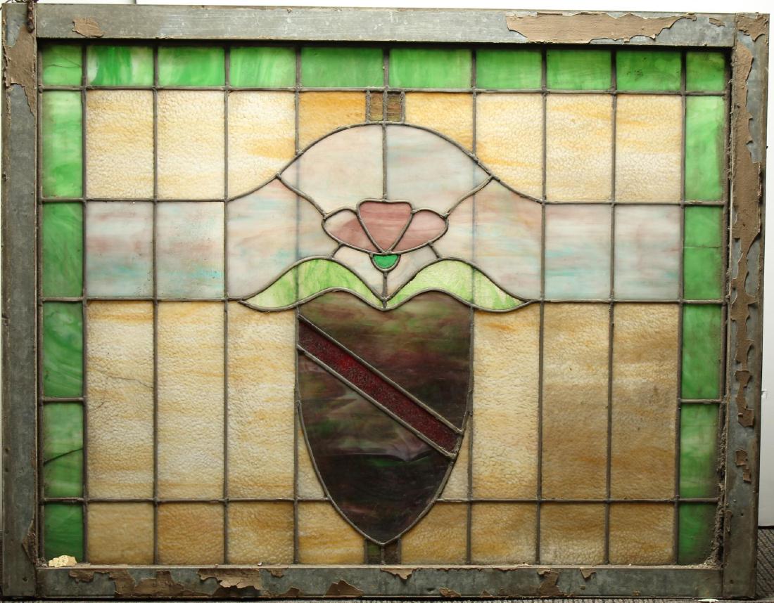 Antique Leaded Stained Glass Window: 34.5" H X 44" W. Panel solid but loose in frame. Property from the estate of the renowned belly dancer Serena Wilson.