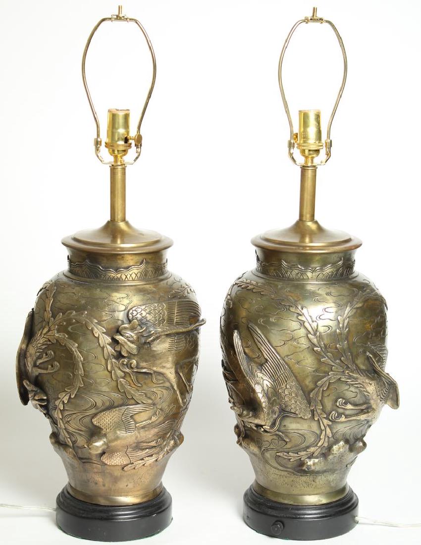 Pair Large Japanese Bronze Vases Mounted as Lamps: Circa 1920s, molded with various birds in high relief. Lamps: 29" H (to harps); vases alone: 14.5" H. Minor rubbing, bottoms drilled.