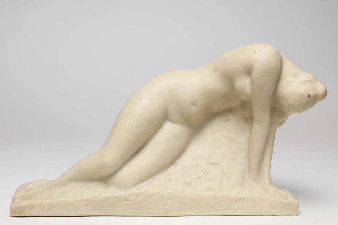 After Vincent Glinsky (American, 1895-1975): "Awakening," reclining nude, cast composite sculpture, signed at left edge. 7" H.