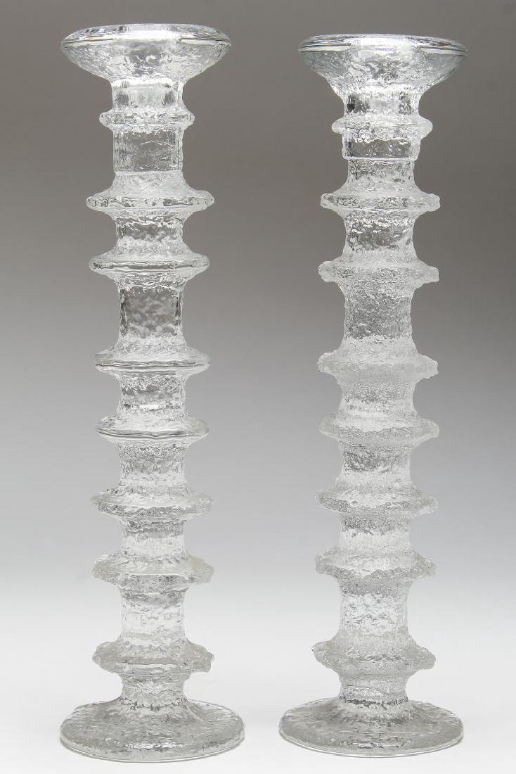 Pair Large Iitala Festivo Candle Sticks, Finland: Mid-Century Modern, vintage 1960s-1970s, after Timo Sarpaneva, each with a white "Made in Finland" mark. Each: 12" H.