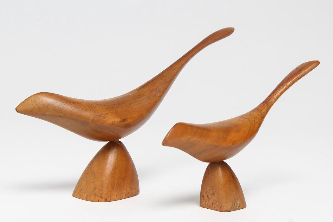 Emil Milan (American, 20th C)- Sculptural Birds: Streamlined, carved on the undersides "Emilan / Walnut;" Milan's work is in the permanent collection of the Smithsonian and the Museum of Arts and Design. Largest: 5" H X 8" L.