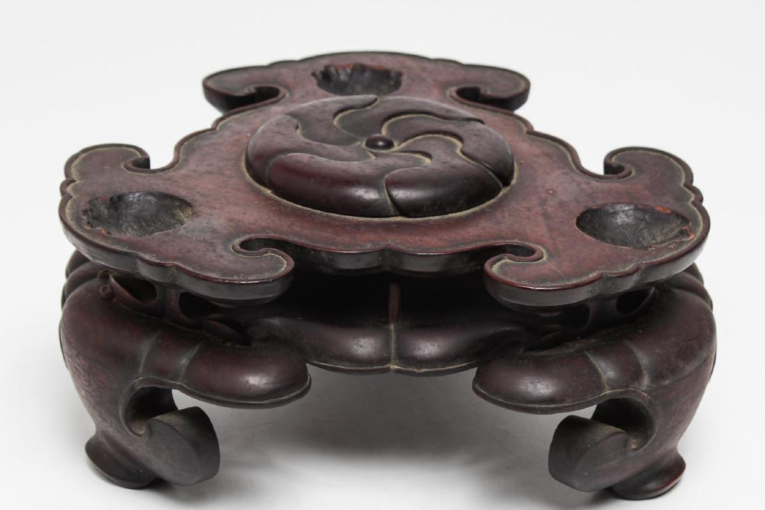 Chinese Qing Carved Hardwood 2-Level Stand: Antique Chinese wood stand, Qing Dynasty, in the form of ruyi scepter heads and feet. 4.25" H X 9.75" diameter. The top with carved indentations for feet.