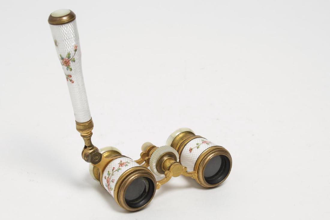 French Enameled Opera Glasses- Carpentier Paris: Vintage Charpentier Fabt. Paris floral-enameled steel and gilt brass opera glasses on folding stem, the eyepiece engraved "LEA Depose." 4" H X 4" W X 2" D.
