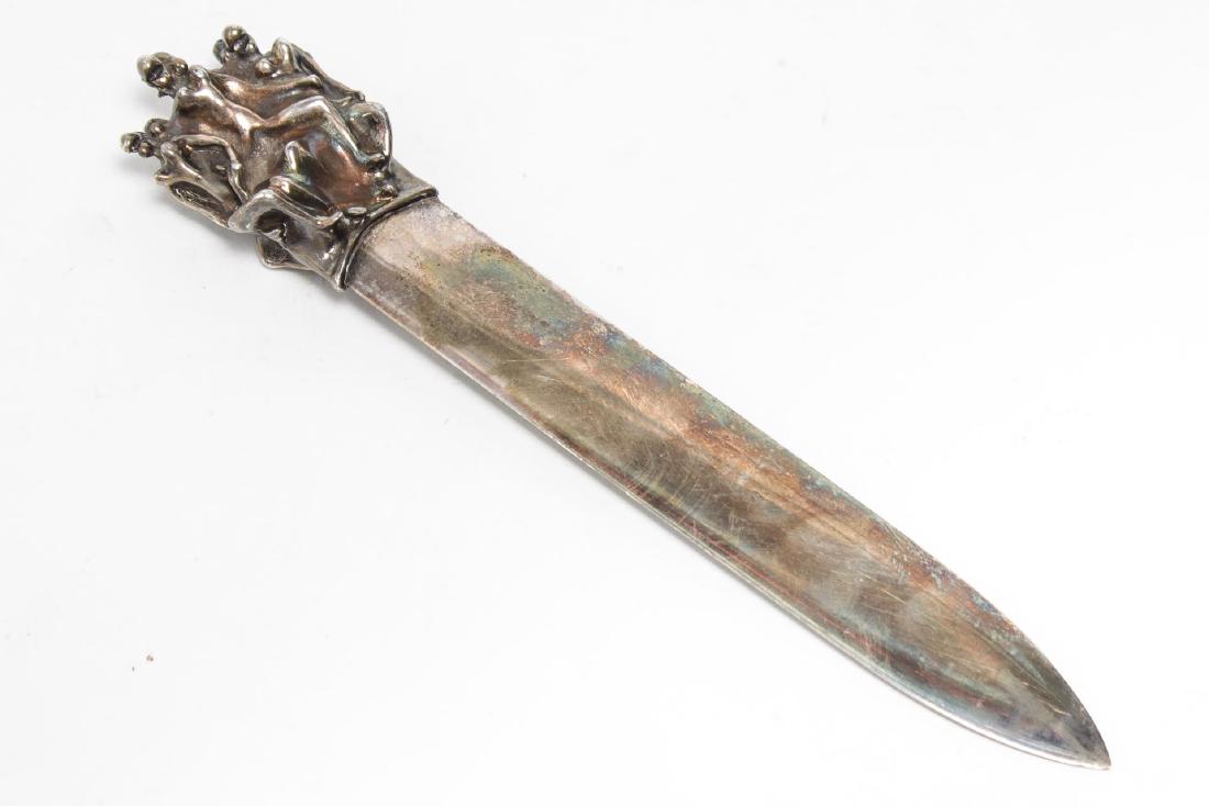 Christofle Silverplate Bronze Erotic Letter Opener: Jean Filhos for Christofle, 1974 silver-plate over bronze letter opener or page turner, with engraved artist's signature on handle and Christofle marks on blade. 7.75" L. Blade with use-appropriate we