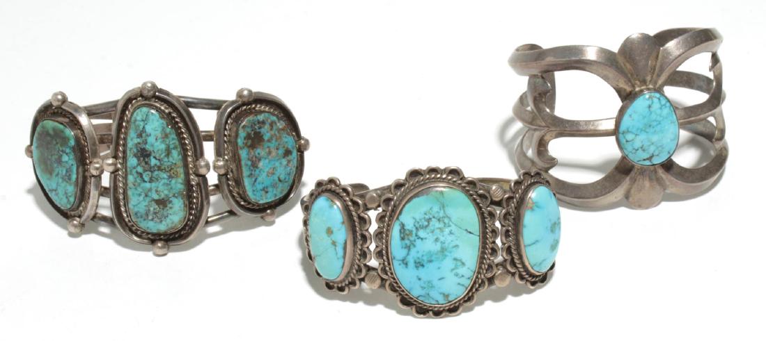 Native American Indian Navajo Cuff Bracelets, 3: Navajo Native American Indian silver and chunk turquoise cuff bracelets, one sand-cast. Inner diameters each: approximately 2.5." Approx. 6.45 ozt. including turquoise.