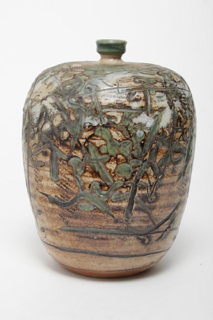 Regis Brodie (American, 20th C.)- Ceramic Vase: Regis Brodie ceramic pottery vase, 20th century, in greens and earth tones bearing maker's mark on underside. 11.5" H.
