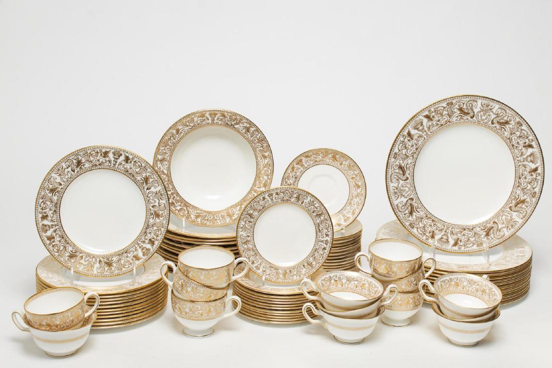 Wedgwood China "Florentine Gold" Dinnerware for 12: Wedgwood bone china "Florentine Gold" partial dinner service for 12, white with gilt border; approximately 75 pieces. Largest: 10.75" diameter.