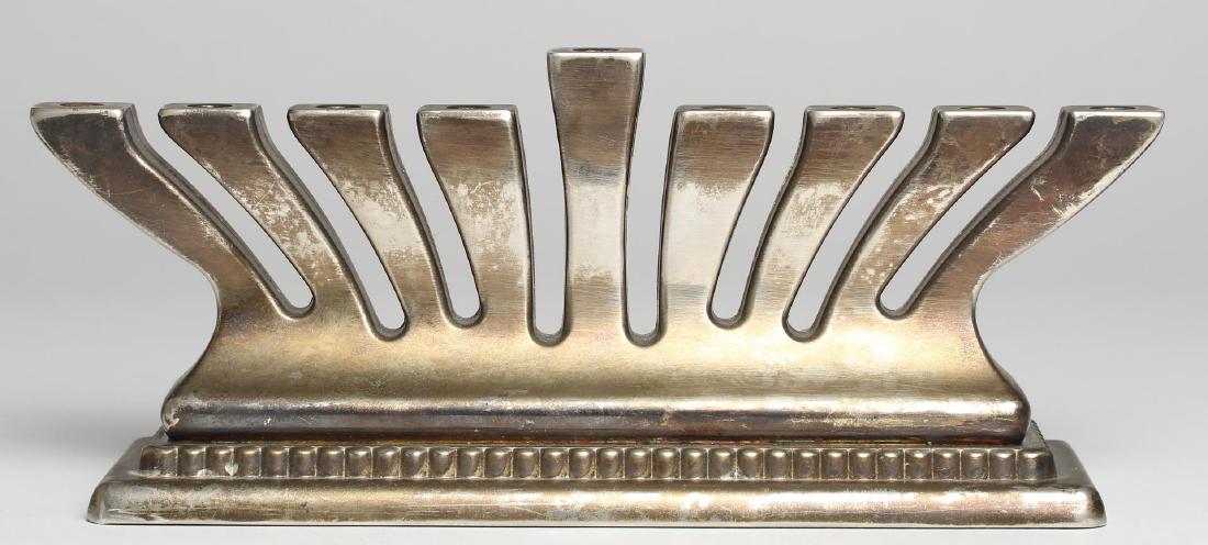 Godinger Judaica Hanukkah Menorah, Silver-Plate: Hanukkah Menorah, Judaica, the underside stamped "© Godinger." 3.75" H X 9" L X 2.25" D.