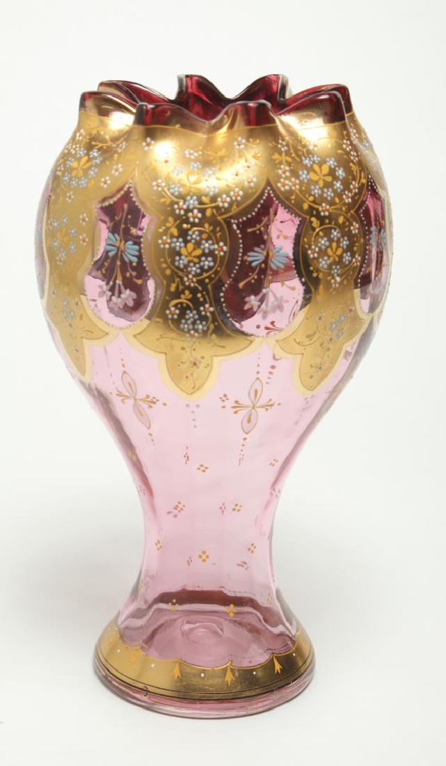 Moser Bohemian Czech Glass Vase, Antique 19th C.: Moser Bohemian Czechoslovakian pink glass vase, antique 19th century, gilt and with floral-painted accents. 12" H X 6" diameter.
