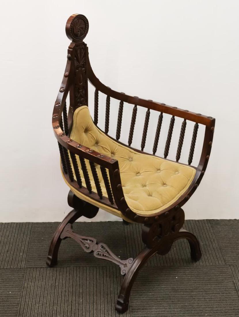 Renaissance Revival Savonarola Wood Chair: Renaissance Revival Savonarola wood chair, carved peaked crest rail and central leaf finial opens to curved seat, the armrests supported by turned spindles, on arched base with stretcher. 43" H X 24.5