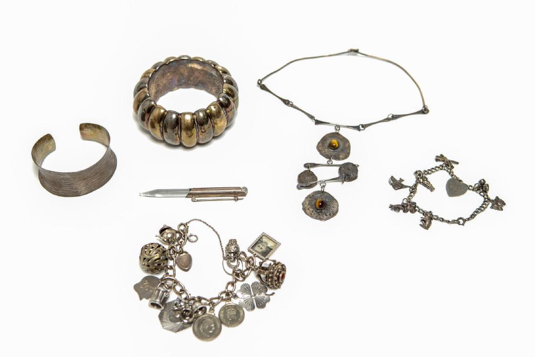 Silver Jewelry, inc. Bracelets & More, 6 Pieces: Sterling and other silver woman's jewelry, comprising a heavy ribbed cuff bracelet illegibly incised and stamped "925," a silver wire cuff, two charm bracelets, one with 14 charms, one dated 1946, the