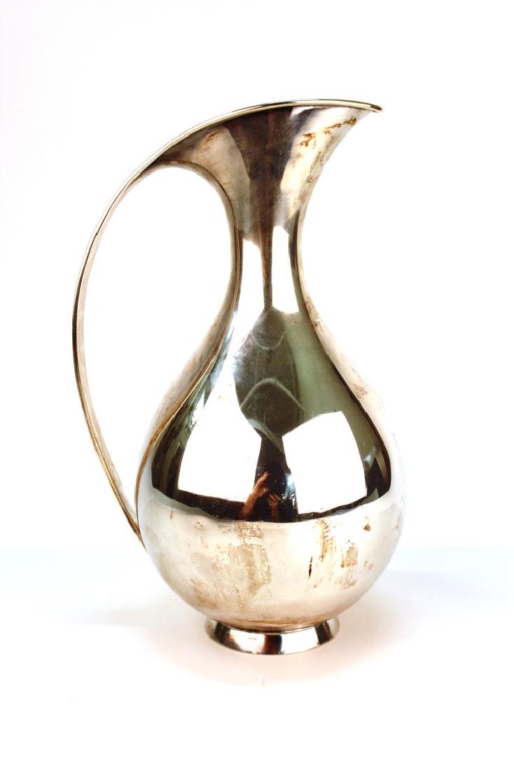 Danish Modern Silver Pitcher by Kay Fisker: Danish Mid-Century Modern sterling silver pitcher by Anton Michelsen, in 1927 streamlined design by Kay Fisker; fully marked underneath. 10.25" H. Approx. 26.5 ozt.