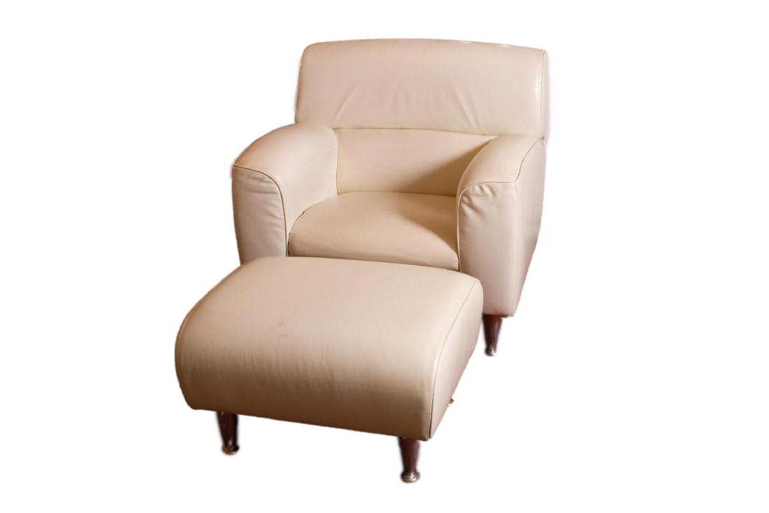 Poltrona Frau Leather "Madison" Chair & Ottoman: Poltrona Frau Italian white leather "Madison" club chair and ottoman on cast aluminum tapered footed peg legs, embossed logo and labels underneath, made in Italy. 34" H x 35" W x 34" D; 17" H x 27" W 