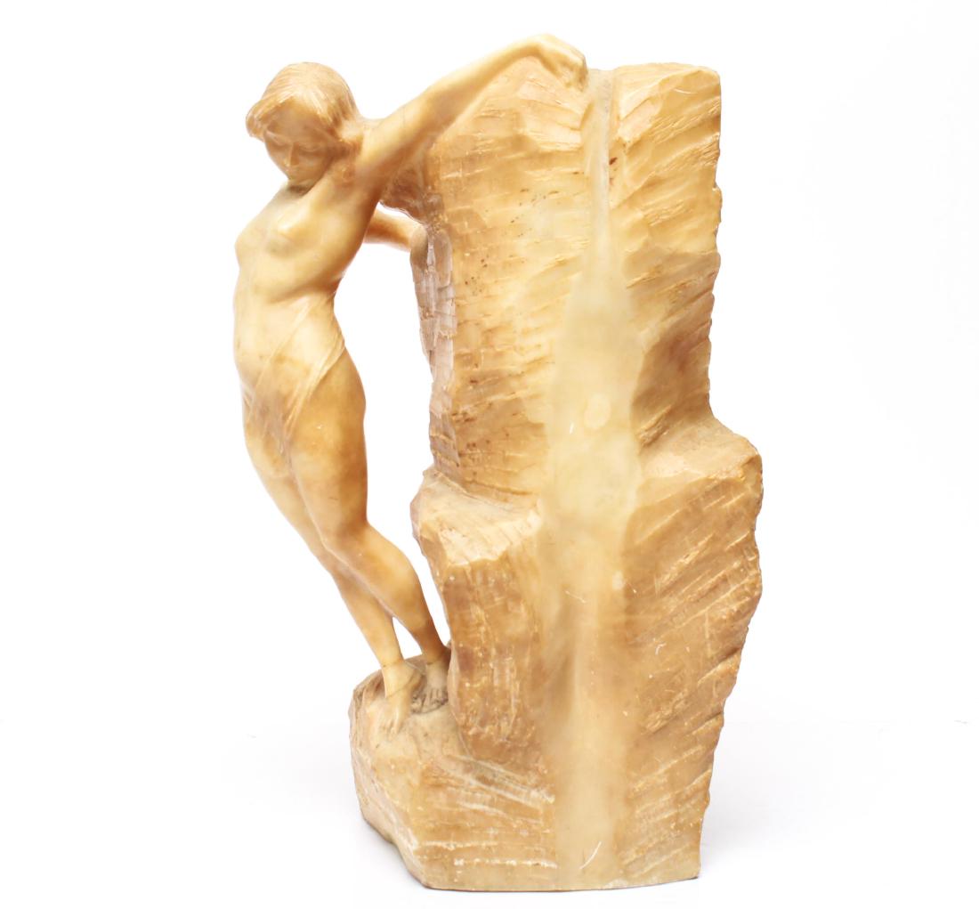 Alabaster Carved Classical Nude Sculpture, 19th C.: Alabaster classical nude, probably Italian, 19th century, the voluptuous young woman carved in the round against a backdrop of large, craggy rocks. 14.5" H. Small chips to some edges, the reverse with