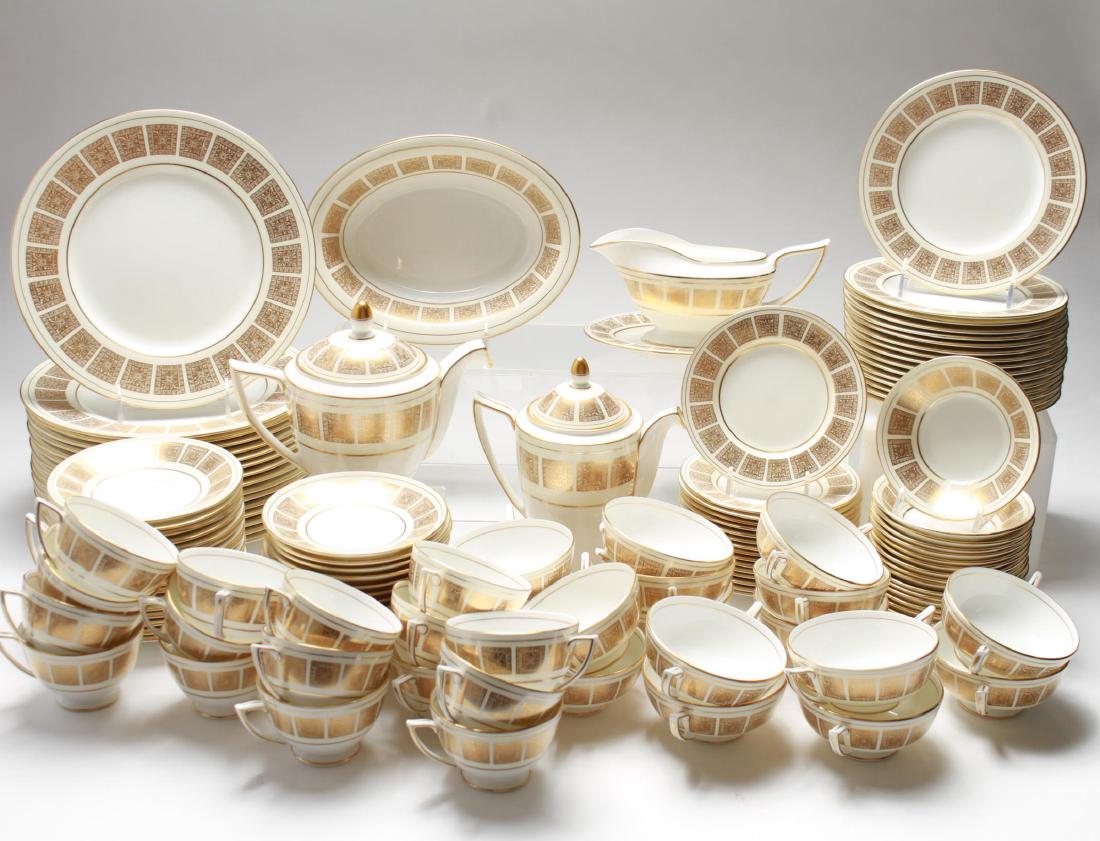 Minton Bone China "Athena Ivory" Dinner Svc for 16: Minton bone china "Athena Ivory"-pattern dinner service for 16, the cream porcelain ground with borders of gilt squares of spiky foliage and egg-and-dart molding, manufactured 1959-1970; approximately